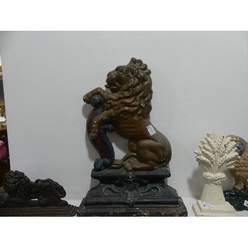 470 - A painted cast iron lion rampant Door Stop, 38cm high, together with three other small door stops; w... 