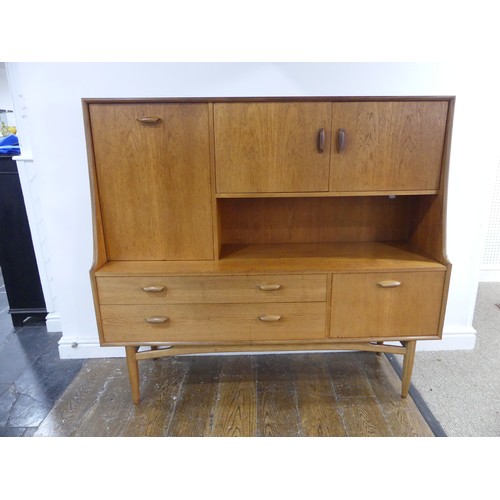 314 - A mid 20thC G-Plan 'Fresco' teak Sideboard, with two drawers, two drop down sections and a cupboard,... 