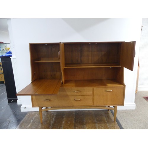 314 - A mid 20thC G-Plan 'Fresco' teak Sideboard, with two drawers, two drop down sections and a cupboard,... 