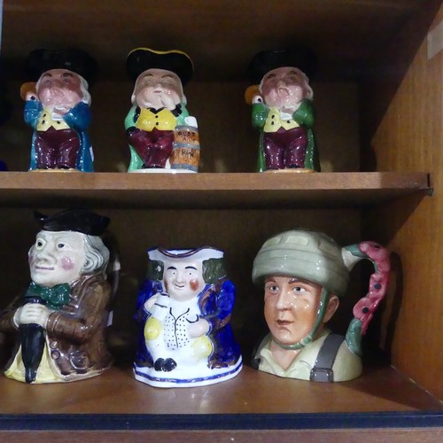 75 - A collection of thirty four various decorative Toby Jugs (a lot)