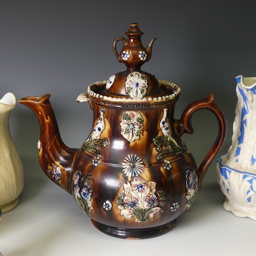 50 - A large Victorian Bargeware Teapot, decorated in typical style, together with a Meigh & Sons Jug... 
