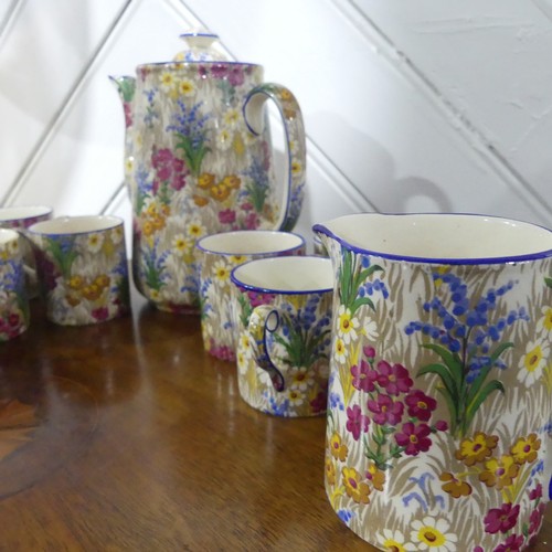 39 - A Royal Winton 'Marguerite' pattern Coffee Set, comprising six Cans and Saucers, Coffee Pot, Cream J... 