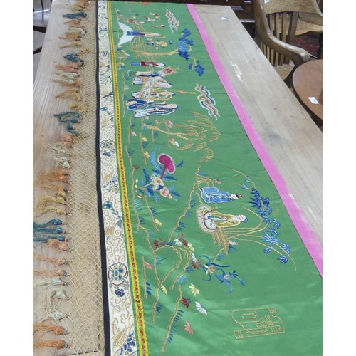 165 - Two early 20thC Chinese Silk Hangings: a green silk panel embroidered with figures in garden scene, ... 