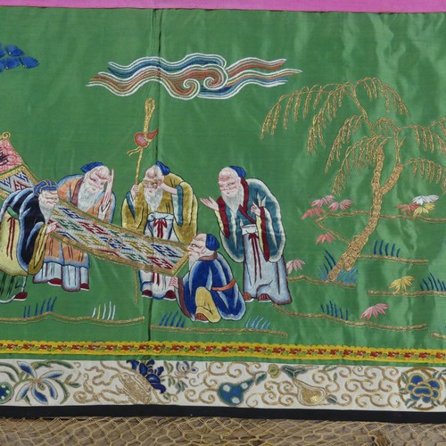 165 - Two early 20thC Chinese Silk Hangings: a green silk panel embroidered with figures in garden scene, ... 