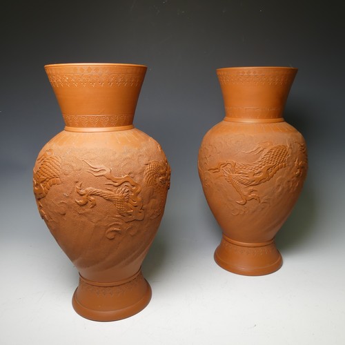 162 - A pair of Japanese Tokoname red stoneware Vases, the stipple ground body decorated in relief with a ... 