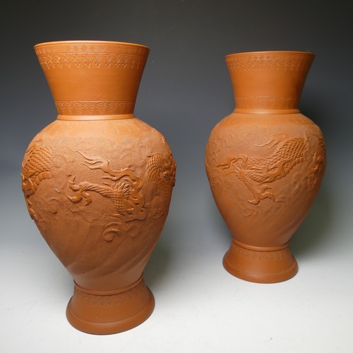 162 - A pair of Japanese Tokoname red stoneware Vases, the stipple ground body decorated in relief with a ... 