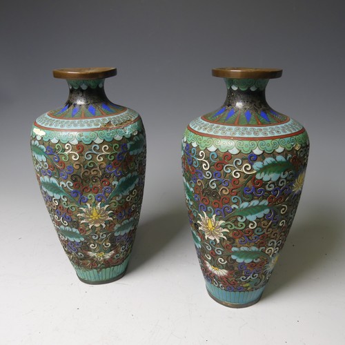 169 - A pair of oriental painted enamel Bowls, decorated in the famille rose palette with flowers on a pal... 