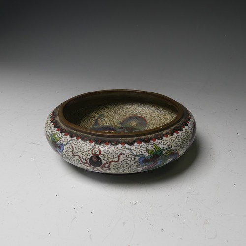 169 - A pair of oriental painted enamel Bowls, decorated in the famille rose palette with flowers on a pal... 