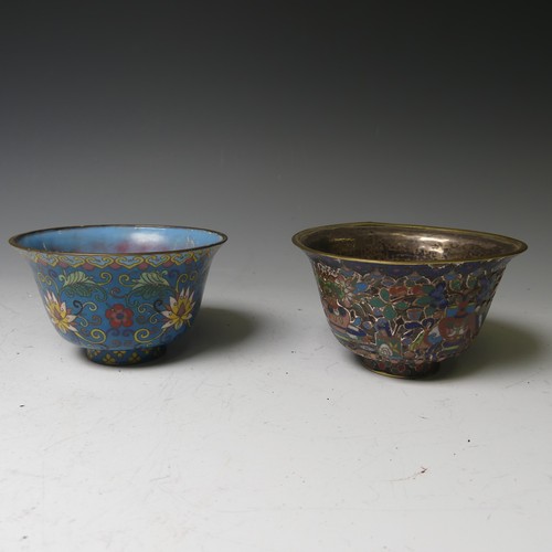 169 - A pair of oriental painted enamel Bowls, decorated in the famille rose palette with flowers on a pal... 