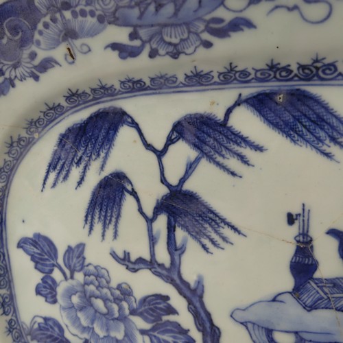 134 - An antique Chinese porcelain blue and white Bowl, with scalloped edge, depicting mountainous scenes,... 