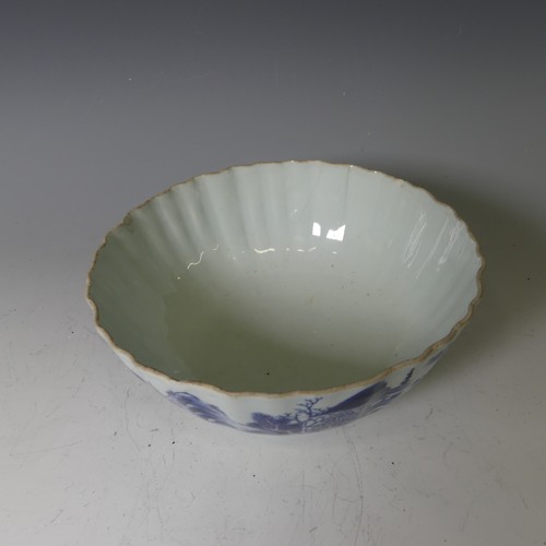 134 - An antique Chinese porcelain blue and white Bowl, with scalloped edge, depicting mountainous scenes,... 