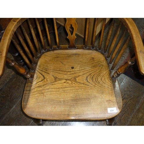 434 - A Late 19thC antique style ash and elm Windsor Chair, with pierced splat back, solid seat raised on ... 