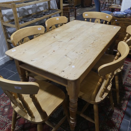 407 - A pine kitchen Table with six Chairs, only one frieze drawer present, W 136cm x H 77cm x D 76cm (tab... 