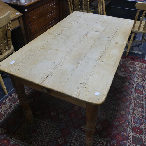 407 - A pine kitchen Table with six Chairs, only one frieze drawer present, W 136cm x H 77cm x D 76cm (tab... 