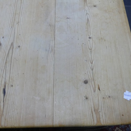 407 - A pine kitchen Table with six Chairs, only one frieze drawer present, W 136cm x H 77cm x D 76cm (tab... 