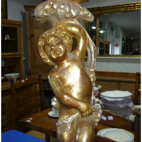 298 - A wooden carved gilt painted side table,  standing cherub to base holding octagonal table 77cm high,... 