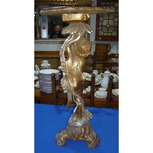 298 - A wooden carved gilt painted side table,  standing cherub to base holding octagonal table 77cm high,... 