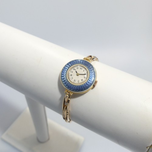 189 - An 18ct yellow gold lady's Wristwatch, with Swiss 15-jewels movement, the white enamel dial with Ara... 