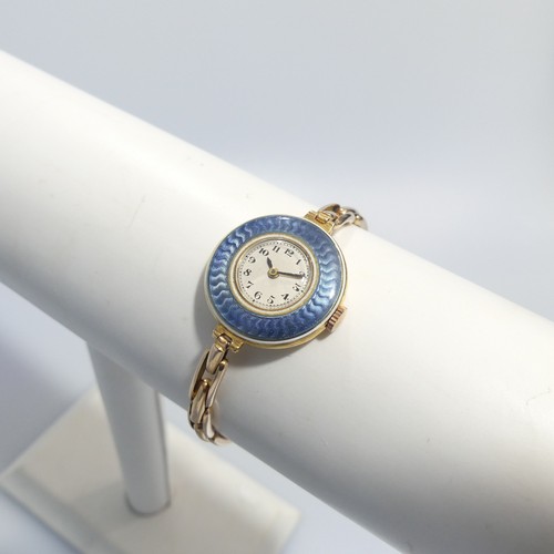 189 - An 18ct yellow gold lady's Wristwatch, with Swiss 15-jewels movement, the white enamel dial with Ara... 