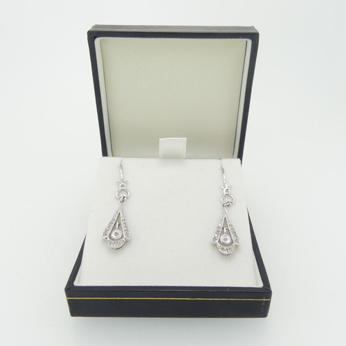 110 - A pair of 18ct white gold Art Deco style drop Earrings, of open triangular form with central circula... 