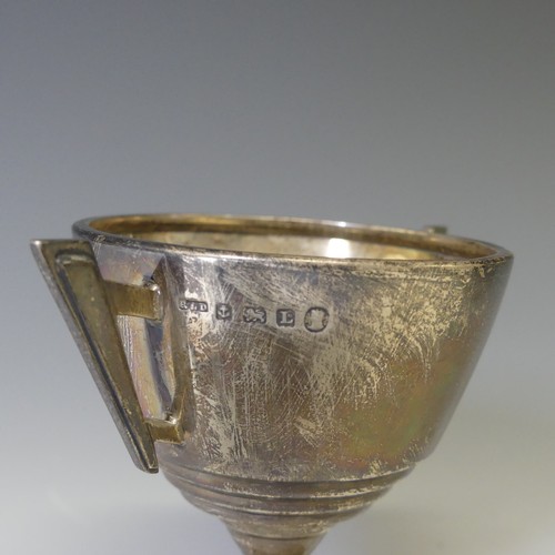 273 - A George V silver two handled Trophy Cup, hallmarked Birmingham 1935, in the Art Deco style, with la... 