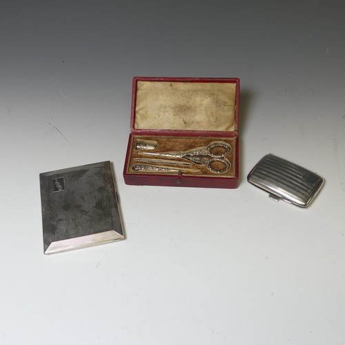 283 - A George V silver Cigarette Case, by W T Toghill & Co., hallmarked Birmingham 1935, with engine ... 