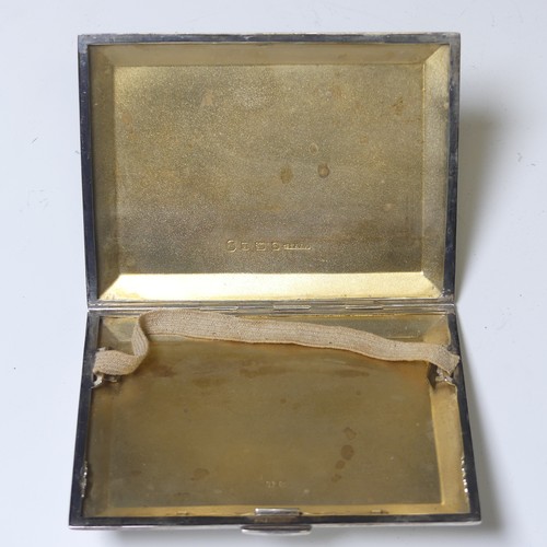 283 - A George V silver Cigarette Case, by W T Toghill & Co., hallmarked Birmingham 1935, with engine ... 