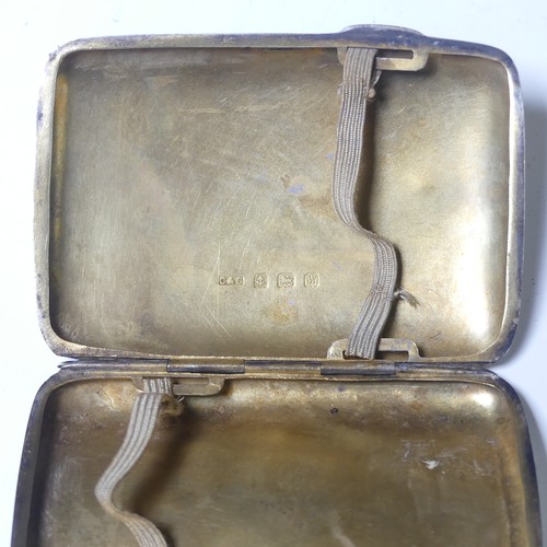 283 - A George V silver Cigarette Case, by W T Toghill & Co., hallmarked Birmingham 1935, with engine ... 