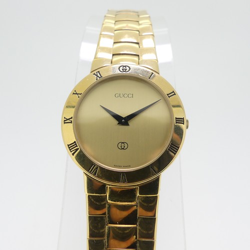 192 - A Gucci gold plated quartz Wristwatch, ref. 3300M, with gilt dial and integral bracelet, case no. 00... 