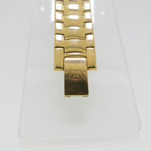 192 - A Gucci gold plated quartz Wristwatch, ref. 3300M, with gilt dial and integral bracelet, case no. 00... 