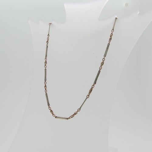 67 - A narrow 9ct gold Watch Chain, formed of ropelinks in rose gold with long oblong links in white, bot... 