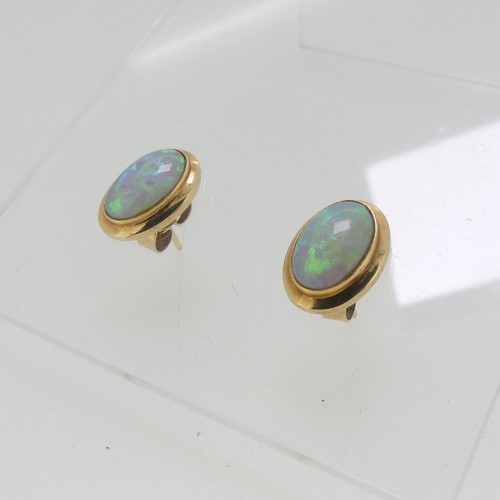 114 - A pair of opal Earrings, the oval stones approx. 11mm x 7mm collet set in unmarked yellow metal, tes... 