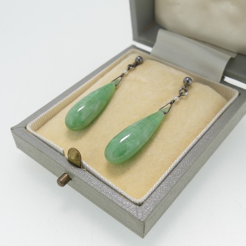 116 - A pair of vintage jade drop Earrings, with seed pearl surmount and stud fittings, the jades 2.5cm lo... 