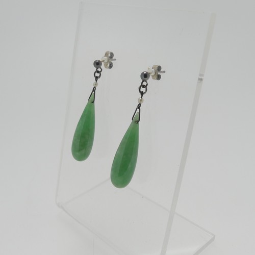 116 - A pair of vintage jade drop Earrings, with seed pearl surmount and stud fittings, the jades 2.5cm lo... 