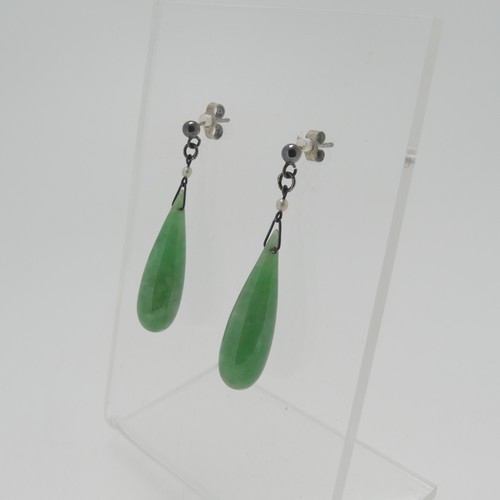 116 - A pair of vintage jade drop Earrings, with seed pearl surmount and stud fittings, the jades 2.5cm lo... 