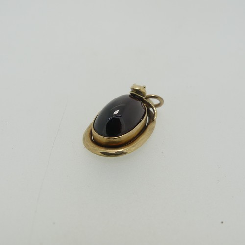 68 - A 19thC cabochon garnet Pendant, the unmarked mount in the form of a coiled snake, box and glass rev... 