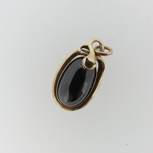 68 - A 19thC cabochon garnet Pendant, the unmarked mount in the form of a coiled snake, box and glass rev... 