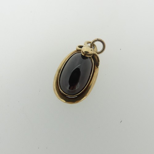 68 - A 19thC cabochon garnet Pendant, the unmarked mount in the form of a coiled snake, box and glass rev... 