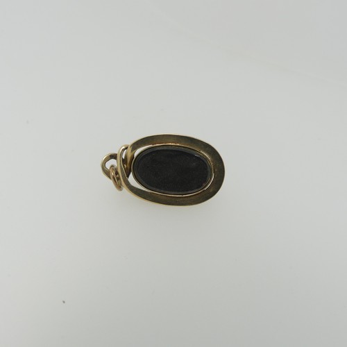 68 - A 19thC cabochon garnet Pendant, the unmarked mount in the form of a coiled snake, box and glass rev... 