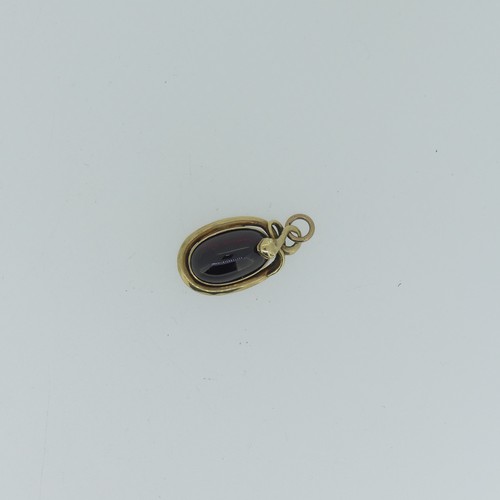 68 - A 19thC cabochon garnet Pendant, the unmarked mount in the form of a coiled snake, box and glass rev... 