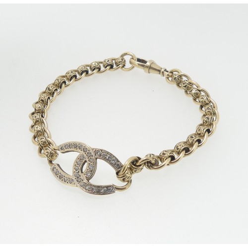 94 - A 9ct gold Bracelet, the front with paste set conjoined C's, watch clip fitting, 19cm long, total we... 