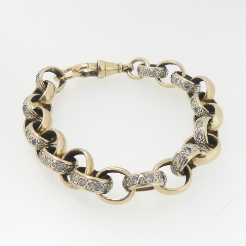 95 - A 9ct gold circular link Bracelet, each alternate link paste set, with watch chain clip clasp, 20cm ... 