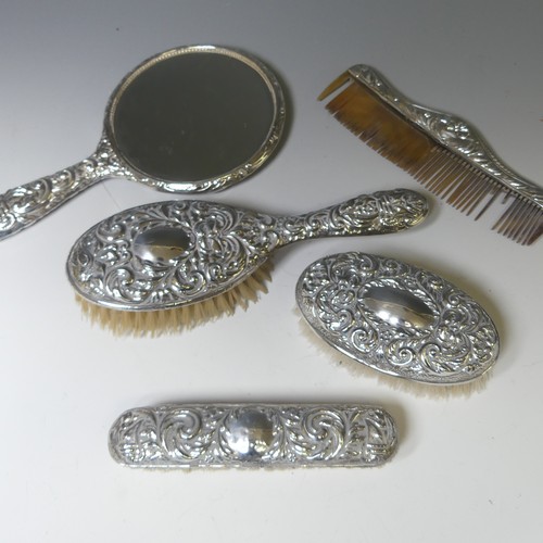 301 - An Elizabeth II silver mounted Hand Mirror, by W I Broadway & Co., hallmarked Birmingham 1958, t... 