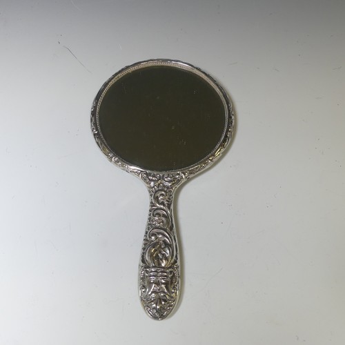 301 - An Elizabeth II silver mounted Hand Mirror, by W I Broadway & Co., hallmarked Birmingham 1958, t... 