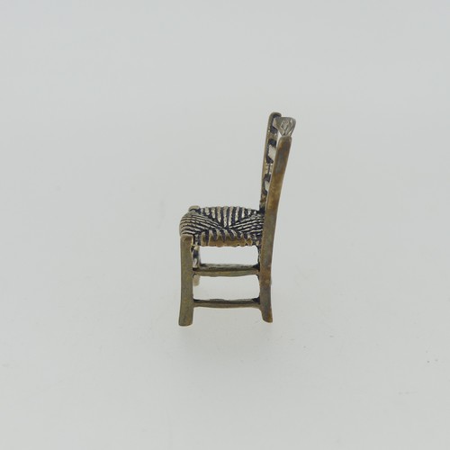 309 - A 19thC Dutch silver miniature Corner Chair, with Shefiield import marks for Samuel Boyce (or Boaz) ... 