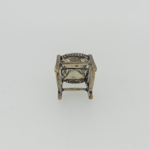 309 - A 19thC Dutch silver miniature Corner Chair, with Shefiield import marks for Samuel Boyce (or Boaz) ... 