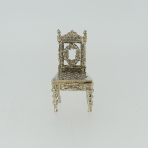 309 - A 19thC Dutch silver miniature Corner Chair, with Shefiield import marks for Samuel Boyce (or Boaz) ... 