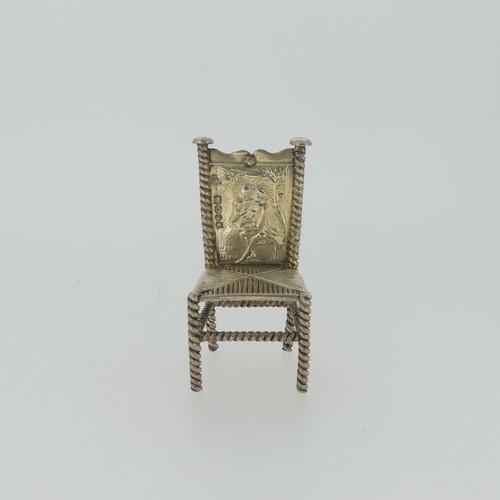 310 - A set of three Continental silver Chairs, with London hallmarks for 1903, 5cm high, together with a ... 