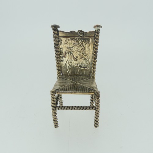 310 - A set of three Continental silver Chairs, with London hallmarks for 1903, 5cm high, together with a ... 