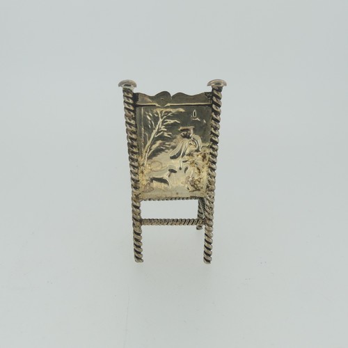 310 - A set of three Continental silver Chairs, with London hallmarks for 1903, 5cm high, together with a ... 